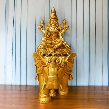 Buy Bass Statue of Lakshmi Seated Gracefully on an Elephant with Trunk Raised – Symbol of Prosperity, Abundance, and Divine Blessings Idols Nikuressence