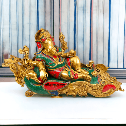 Buy pure Brass Ganesha Idol Relaxing on Peacock Recliner - nikur essence Idols Nikuressence