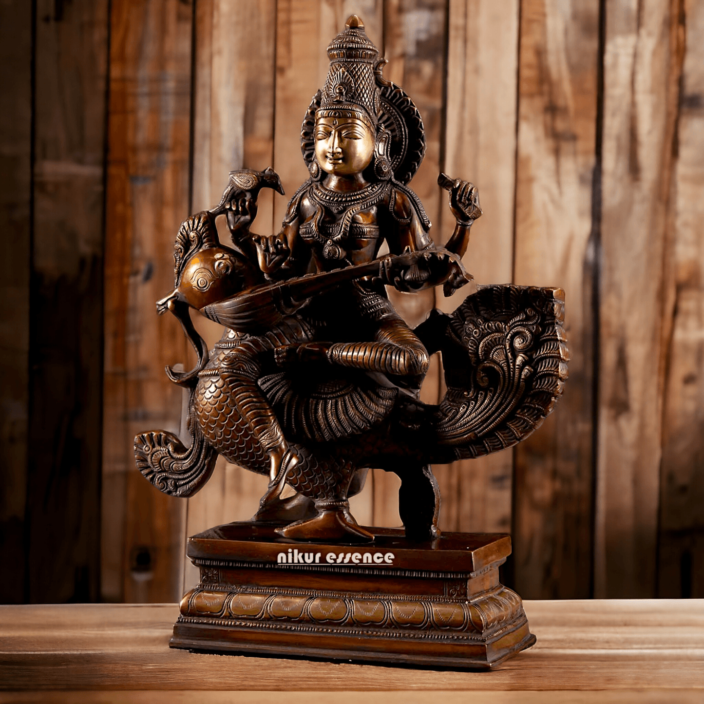 Brass Statue of Hindu Goddess Saraswati, the Patron of Wisdom, Playing Veena atop a Majestic Peacock with a Parrot Perched on Her Hand, 20 Inches