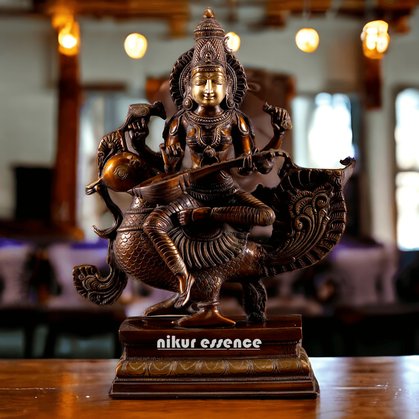 Brass Statue of Hindu Goddess Saraswati, the Patron of Wisdom, Playing Veena atop a Majestic Peacock with a Parrot Perched on Her Hand, 20 Inches