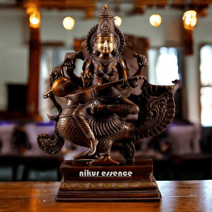 Brass Statue of Hindu Goddess Saraswati, the Patron of Wisdom, Playing Veena atop a Majestic Peacock with a Parrot Perched on Her Hand, 20 Inches