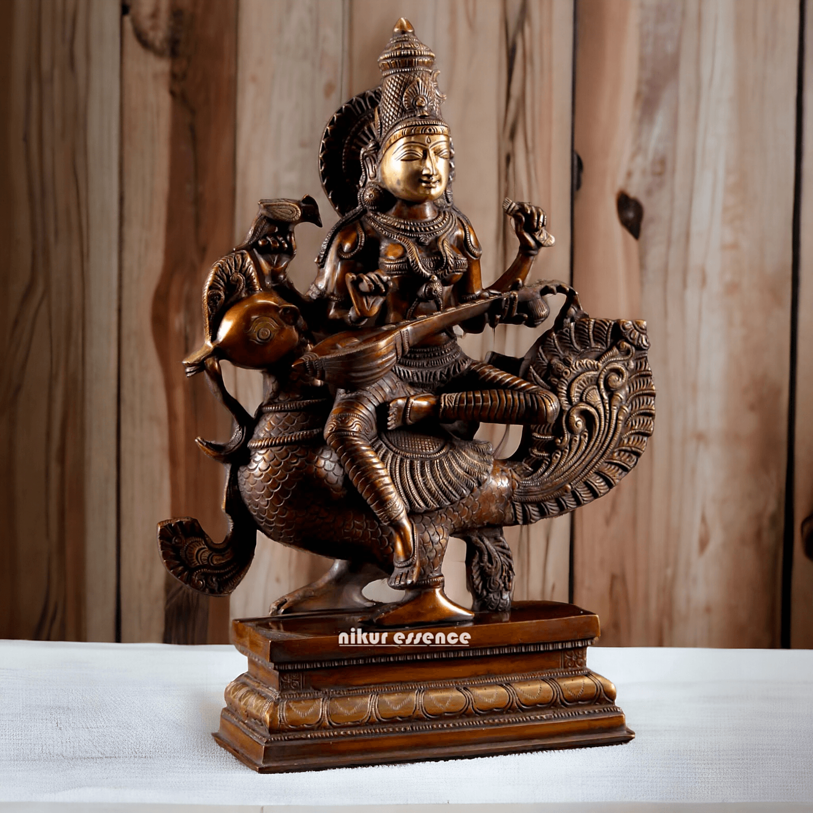 Brass Statue of Hindu Goddess Saraswati, the Patron of Wisdom, Playing Veena atop a Majestic Peacock with a Parrot Perched on Her Hand, 20 Inches