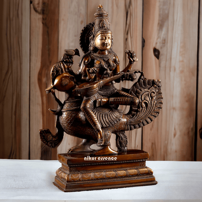 Brass Statue of Hindu Goddess Saraswati, the Patron of Wisdom, Playing Veena atop a Majestic Peacock with a Parrot Perched on Her Hand, 20 Inches