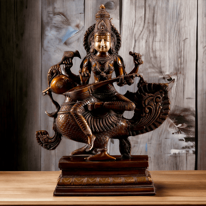 Brass Statue of Hindu Goddess Saraswati, the Patron of Wisdom, Playing Veena atop a Majestic Peacock with a Parrot Perched on Her Hand, 20 Inches