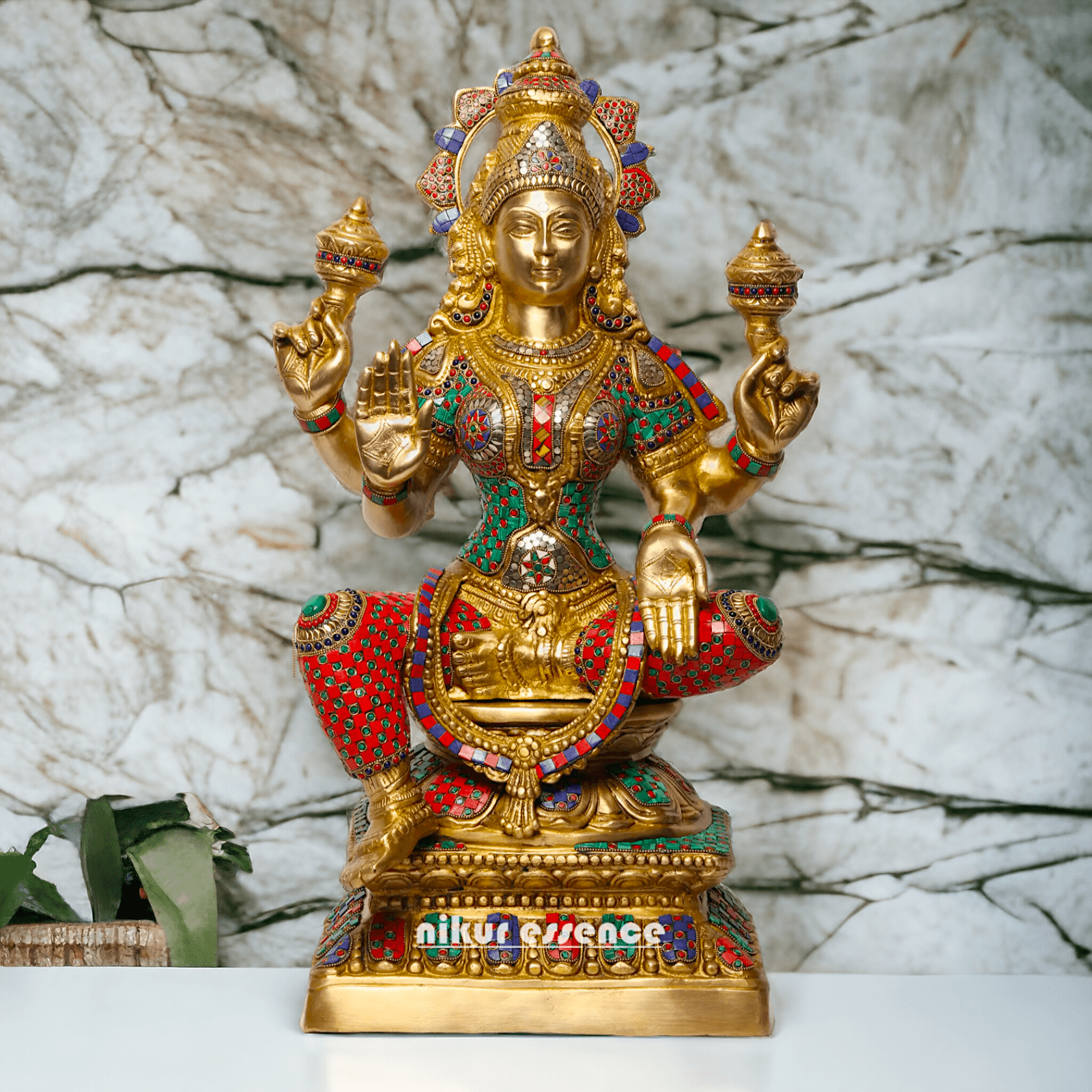 Buy Online Brass Statue of Lakshmi, Sitting Gracefully with Four Arms, Adorned with Intricate Inlay Work