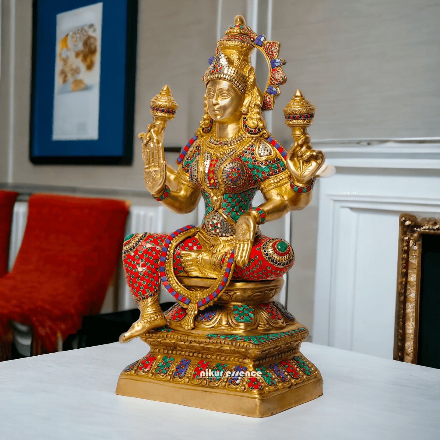 Buy Online Brass Statue of Lakshmi, Sitting Gracefully with Four Arms, Adorned with Intricate Inlay Work