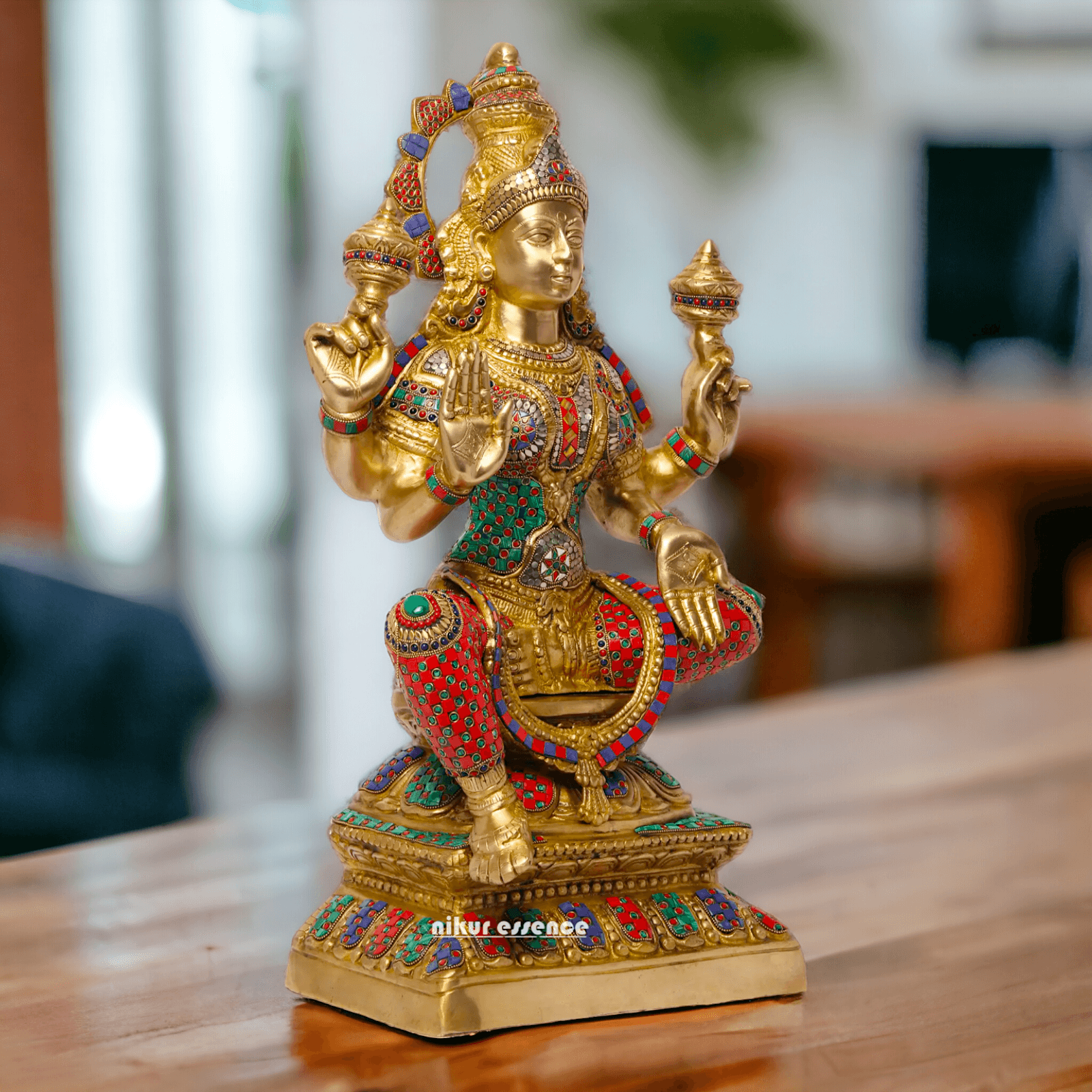 Buy Online Brass Statue of Lakshmi, Sitting Gracefully with Four Arms, Adorned with Intricate Inlay Work