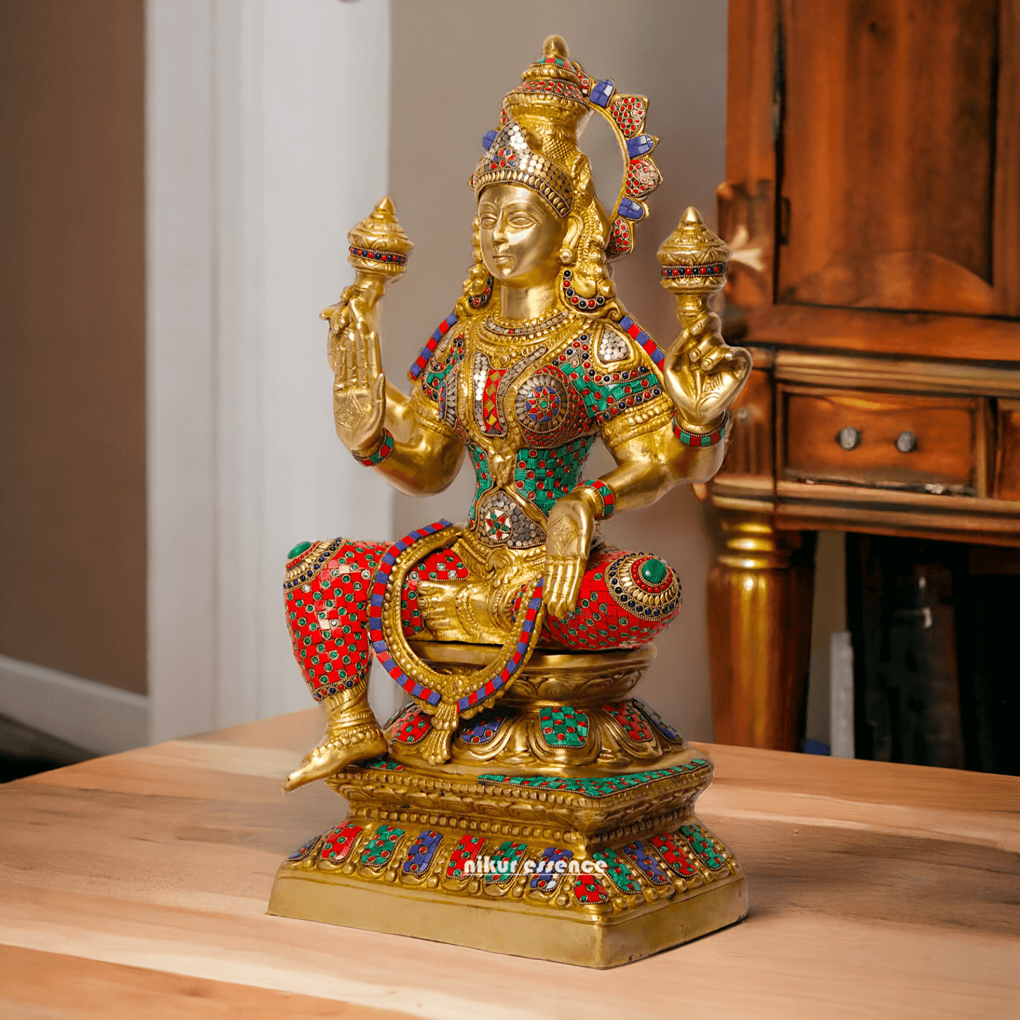 Buy Online Brass Statue of Lakshmi, Sitting Gracefully with Four Arms, Adorned with Intricate Inlay Work