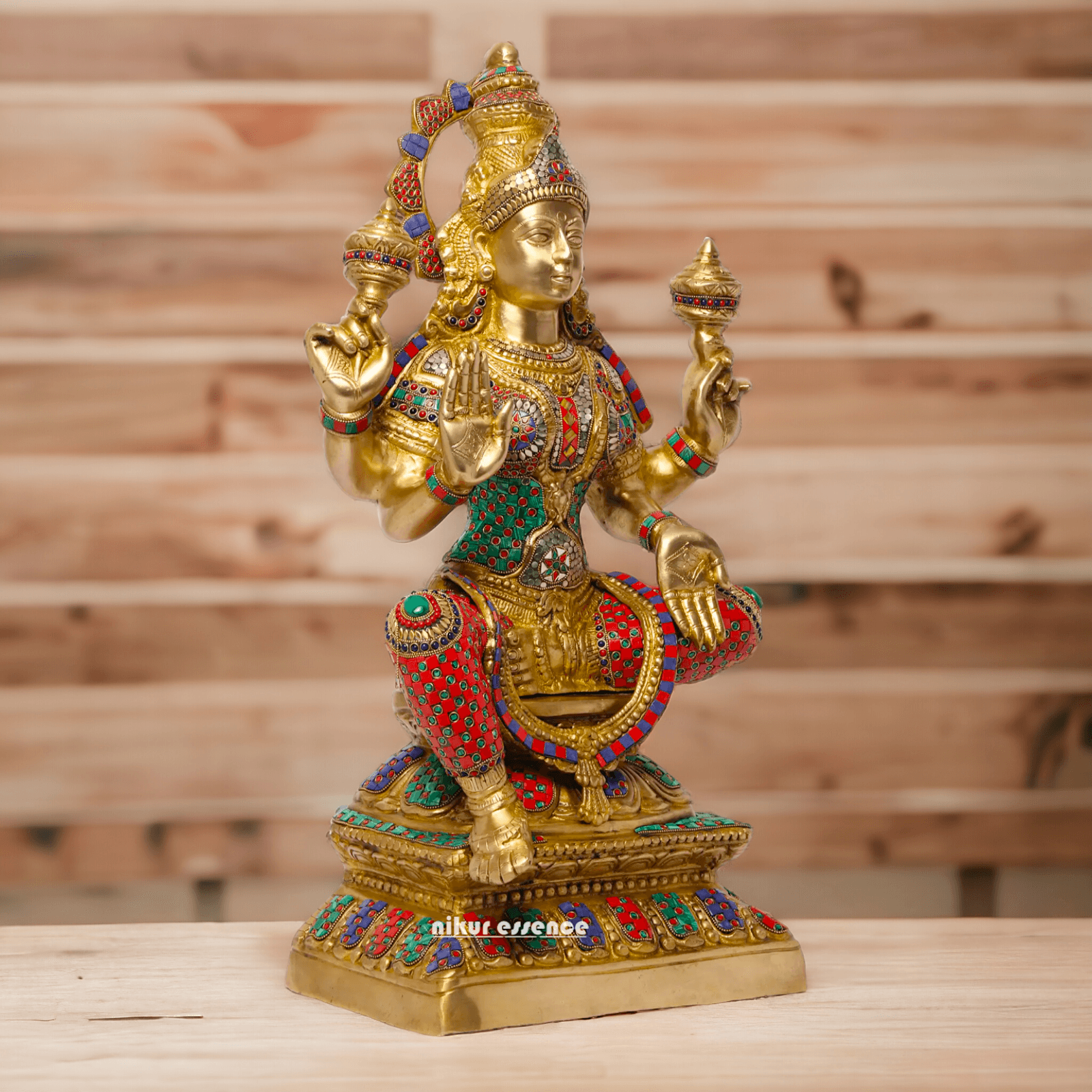 Buy Online Brass Statue of Lakshmi, Sitting Gracefully with Four Arms, Adorned with Intricate Inlay Work