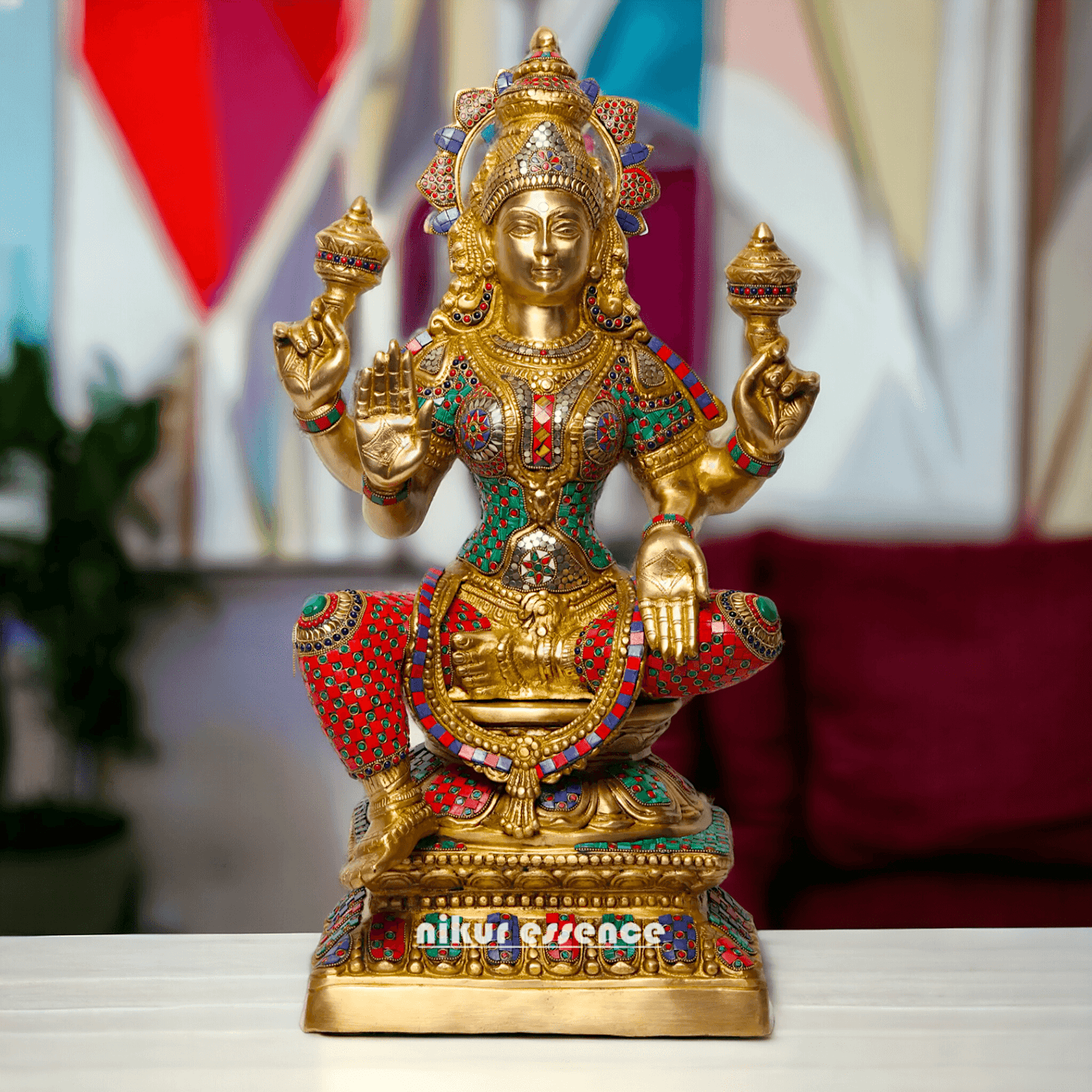 Buy Online Brass Statue of Lakshmi, Sitting Gracefully with Four Arms, Adorned with Intricate Inlay Work