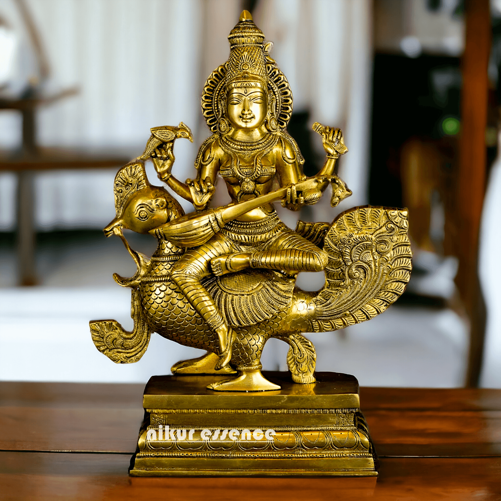 Buy Brass Statue of Devi Sarasvati Seated Gracefully on Her Sacred Peacock Idols Nikuressence