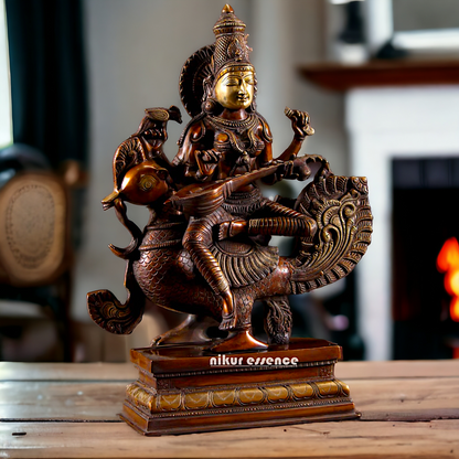 Saraswati Playing the Veena While Seated on a Grand Peacock, With a Parrot Gracefully Perched on Her Hand – Exquisite 20-Inch Handcrafted Figurine Idols Nikuressence