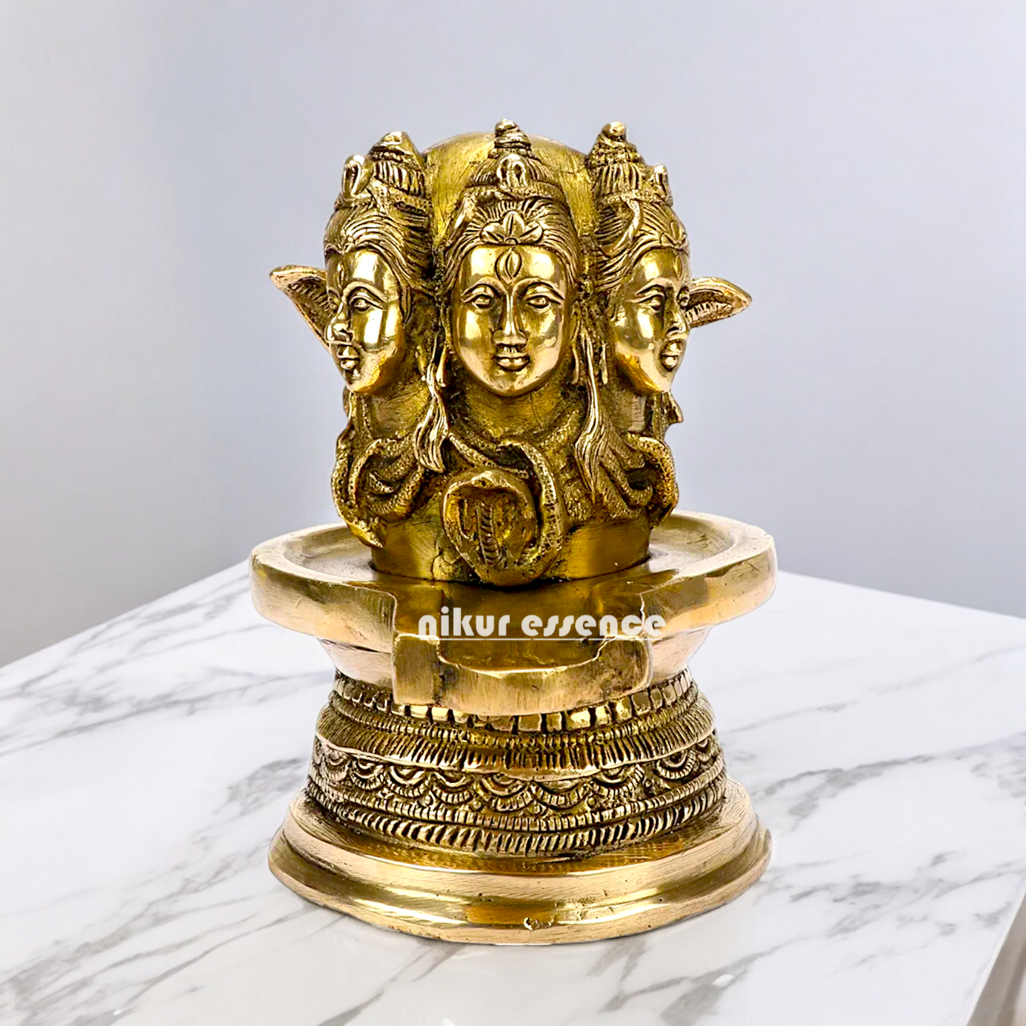 Solid Brass Shivling with Three Face Shiva idol on Shivling Idol - 16 cm