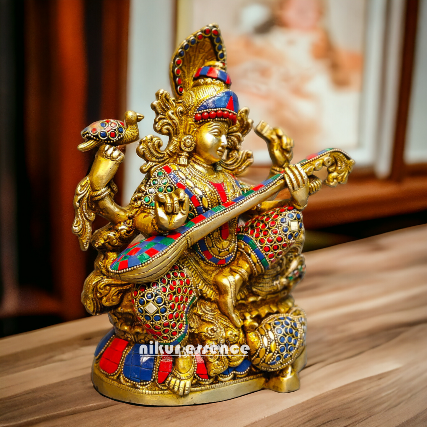 Buy Brass Saraswati Sitting Playing Veena with Stone Work - 27 cm