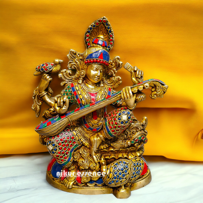 Buy Brass Saraswati Sitting Playing Veena with Stone Work - 27 cm