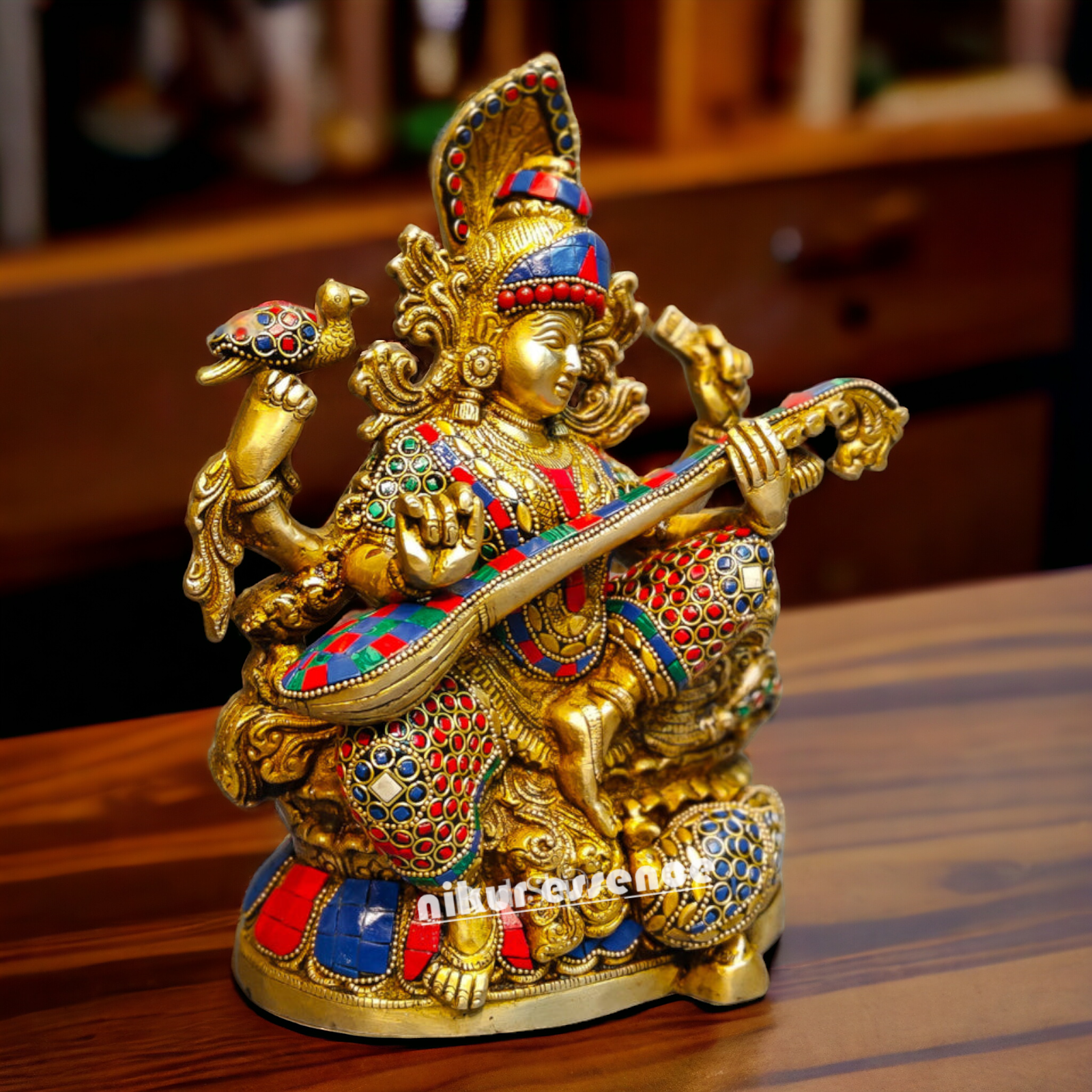 Buy Brass Saraswati Sitting Playing Veena with Stone Work - 27 cm