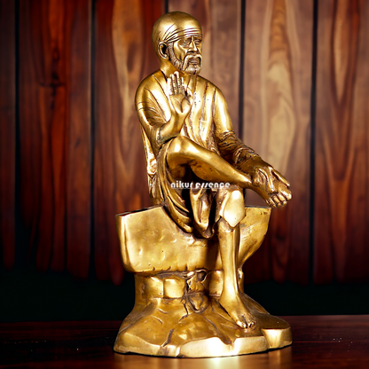 Pure Brass Sai Baba Sitting on Stone idol - 12 inches