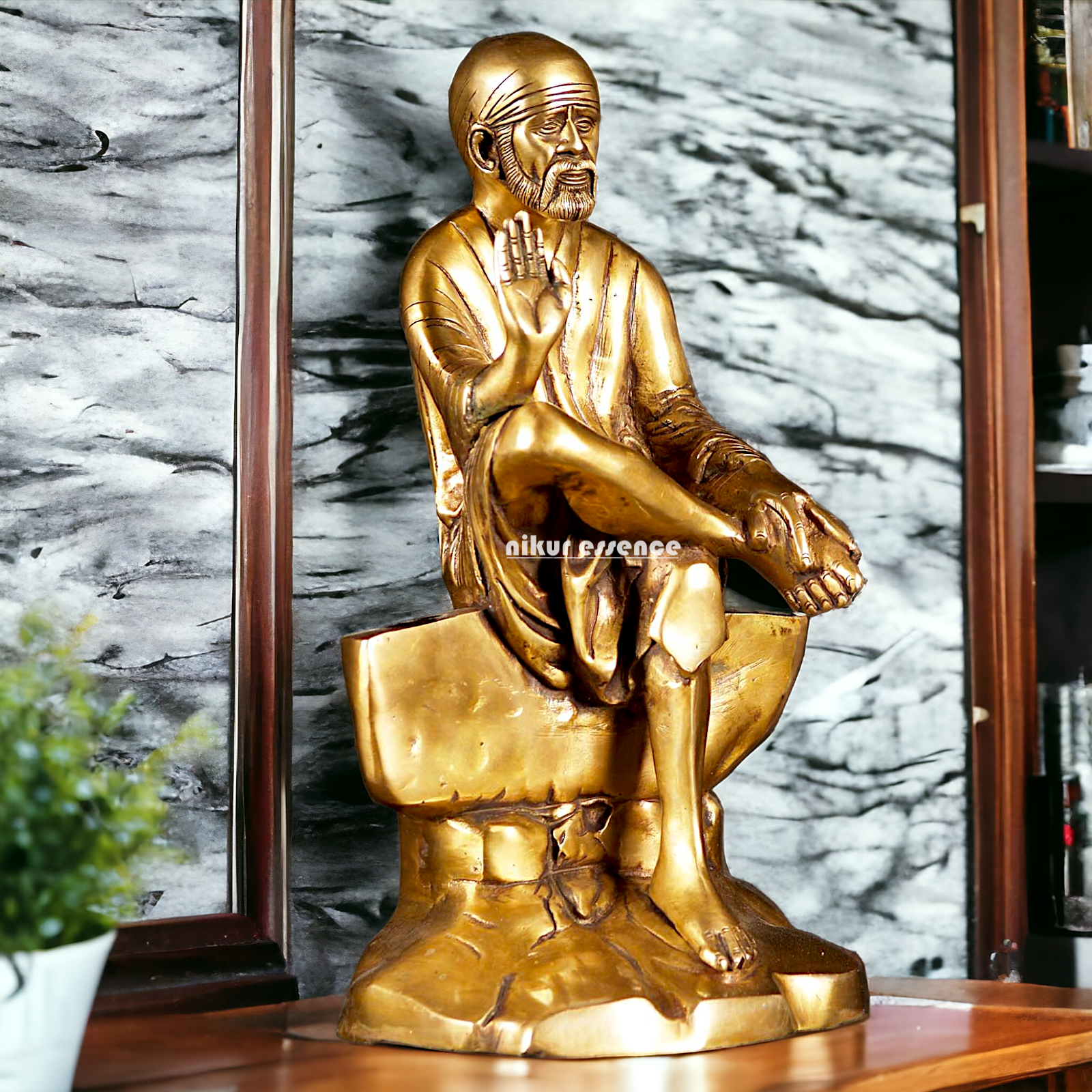 Pure Brass Sai Baba Sitting on Stone idol - 12 inches