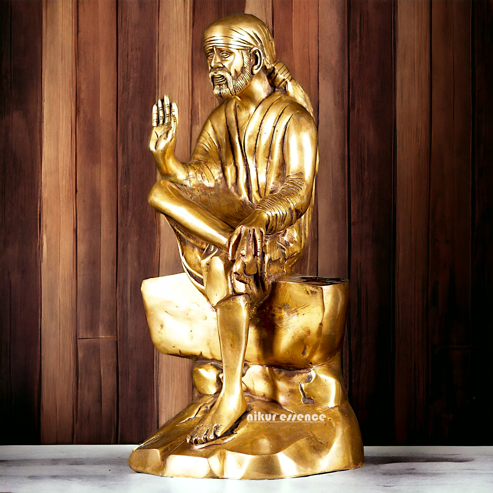 Pure Brass Sai Baba Sitting on Stone idol - 12 inches