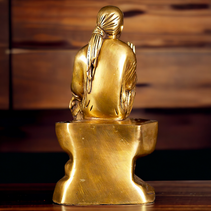 Pure Brass Sai Baba Sitting on Stone idol - 12 inches