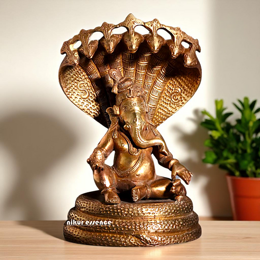 Bronze/Panchaloha Ganesha seated on sheshnag statue - 7 Inches Nikuressence
