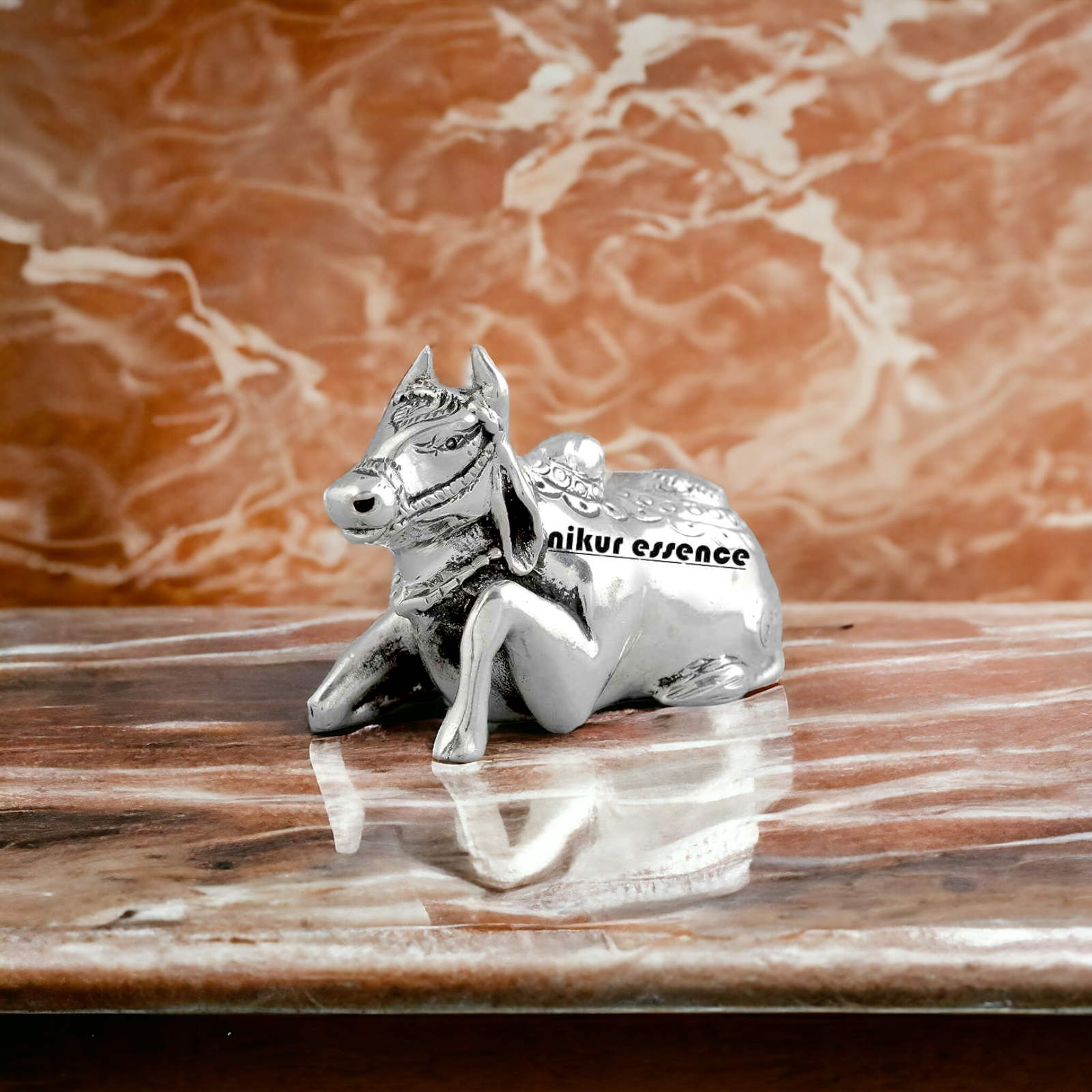 Sacred Cow in Silver in sitting position