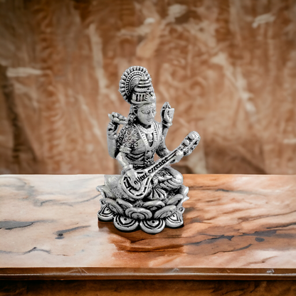 Buy Silver Saraswati mata Idol -nikuressence Nikuressence DivineBlessings GoddessIdols GoddessSaraswati HinduDeities HinduFestivals Hinduism HinduRituals HomeDecorInspo IndianCulture IndianFestivals KnowledgeAndWisdom LuxuryHomeDecor MusicAndArts nikuressence PujaRoomEssentials SaraswatiPuja SilverIdols SilverSaraswatiDeviIdol SpiritualGrowth SpiritualJourney VastuCompliant