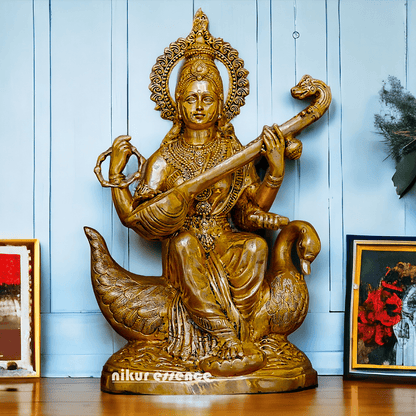 Statue of Hindu in brass Maa Saraswati, Depicted Riding a Swan and Playing the Veena, Symbolizing Wisdom, Arts, and Learning in Hindu Mythology